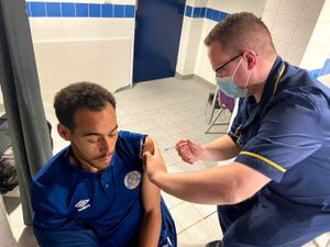 Town star Elliot Bennett gets his booster jab
