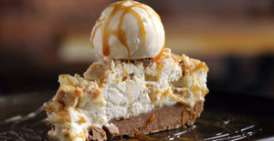 A creamy cheesecake smothered in ice cream
