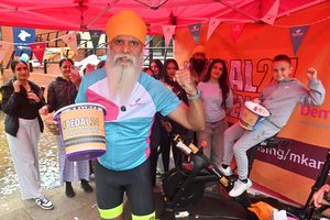 Manny Singh Kang was surrounded by family, friends and supporters as he completed his latest marathon fundraising challenge