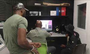 RA works with the youngsters to help put their tracks together