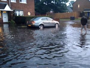 Supporting image for story: Homes under water and car stranded in Trescott Ford as downpours continue
