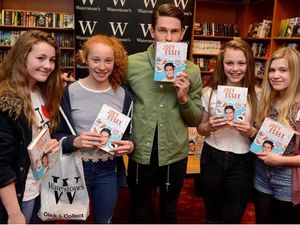 Supporting image for story: From Essex to the Black Country - Joey signs books at Merry Hill