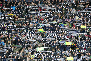 Stunning tribute to Cyrille Regis as fans hold their scarves high. (Picture: © AMA/Adam Fradgley)