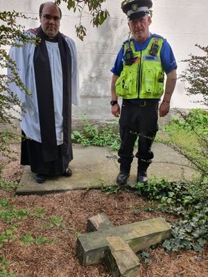 PCSO Lewis pictured with Rev Simon Skidmore and the cross