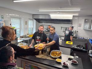 Chun and Jake serving the free baps.