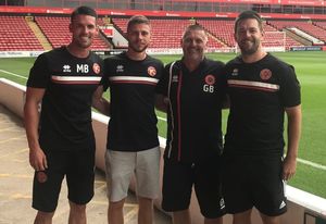 Matty Fryatt, right, with Mark Bradley, left, George Bowerman, second left, and academy manager Graham Biggs, second right. Photo: Walsall FC