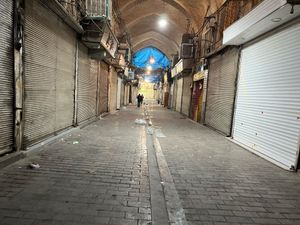 Supporting image for story: Security forces clash with protesters in Iran’s main market