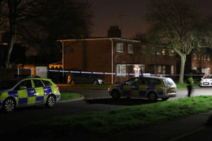 Police at the cordoned-off scene following the murder