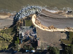 Supporting image for story: Aerial images show demolition of fourth clifftop home amid coastal erosion