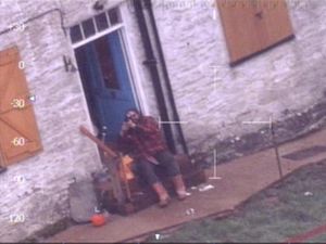 Supporting image for story: Caught on camera: Terrifying moment Oswestry gunman shoots at police helicopter