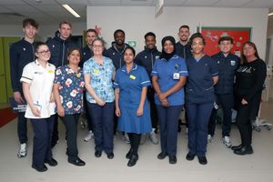 Players from West Bromwich Albion with staff on the children's ward at the Midland Met