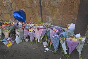 Dozens of bouquets of flowers have been left at the scene of the fatal crash