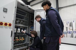 Iconsys apprentices Ben Morris-Jones and Rheon Paul (left and right) with former apprentice and electrical test technician Jack Evans