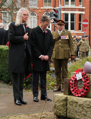 Llandrindod Wells Mayor Councillor Steve Deeks-D’Silva, Powys County Council Leader Councillor Jake Berriman show respect after laying their wreaths. Pic by Andy Compton