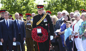 Prince Harry, lays a wreath during the dedication of the Bastion Memorial at the National Memorial Arboretum
