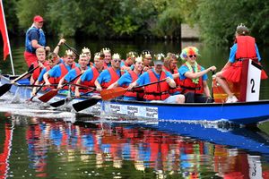 Crowns and multi-coloured afros were the headgear of choice for this team at the Severn Hospice Dragon Boat Festival