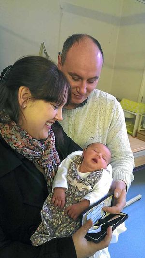 Parents Paul Round and Susan Millichamp with baby Elsie.