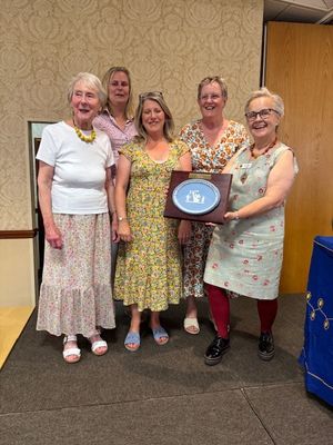 Brocton WI awarded with a trophy for the Best dressed Table
