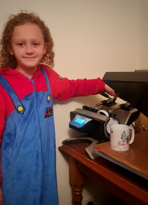 Simon and Myles have been busy printing mugs ready to deliver. Photo: Simon Parkes