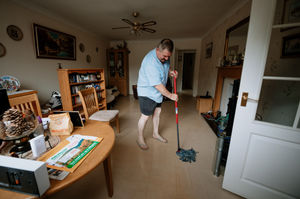 Stephen Watson, age 62, cleaning his affected home in Wrens Nest Lane, Ketley