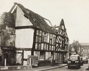 An 18th century black and white building in the town was deemed unsafe and was being demolished in January, 1961.
