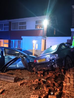 A BMW was pushed up against the wall