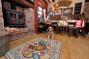 Bella the dog with Stewart and Jade Wheaver at the newly re-opened Cock Hotel, where Joule's Brewery has completed a major refurbishment and restoration project.
