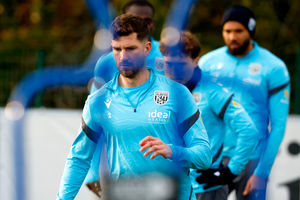 Chris Mepham leads the way during some warm-up drills. (Photo by Adam Fradgley/West Bromwich Albion FC via Getty Images)