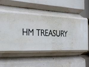 A view of signage for HM Treasury in Westminster, London