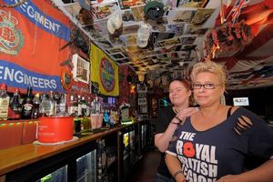 Big-hearted landlady Julie Cooper, right, seen here with the pub's DJ