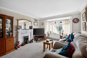 A bright and spacious main lounge complemented by a separate dining room, providing flexible family living space