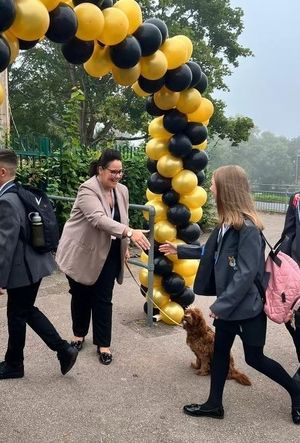The Hart School's principal, Rachael Sandham, greeting every new pupil alongside therapy dog Rufus.