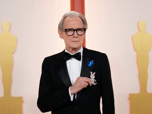 Supporting image for story: Bill Nighy wears blue ribbon at Oscars in solidarity with displaced people
