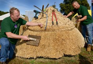 Showing their thatching skills are Chris Pike and Mike Lovett from All Counties Thatching in Shrewsbury