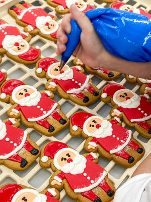 Original Biscuit Bakers Santa being decorated