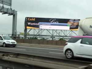 Supporting image for story: Anti-virus software message pops up as glitch hits giant M6 ad board