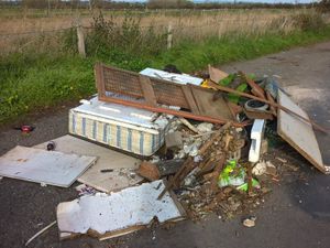 Supporting image for story: Fly-tippers dump mattress, rabbit hutch and door on Shropshire road
