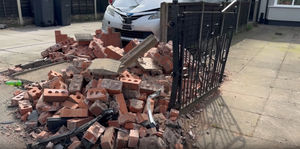 Shocking CCTV shows the moment a speeding car caused thousands of pounds of damage after crashing into two gardens in a city suburb.