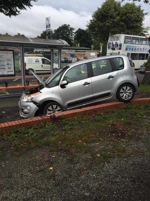 The car was left hanging by a wheel. Picture by DEEJON