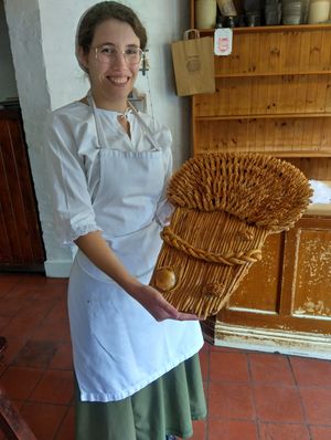 Eleanor Atkins, Demonstrator in the bakery at Blists Hill Victorian Town, preparing bread for the Harvest Festival