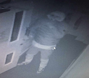 One of the raiders seen on CCTV in a hooded top