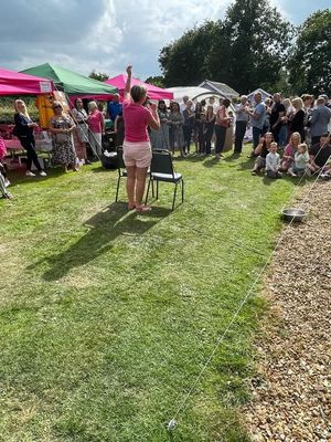 Mandy calling the raffle prizes including restaurant vouchers, beauty treatments and a signed Wolves FC shirt