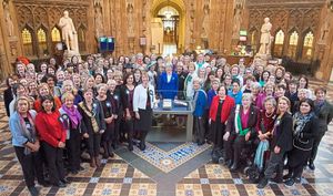 Theresa May joins female members of both houses to mark the 100th anniversary
