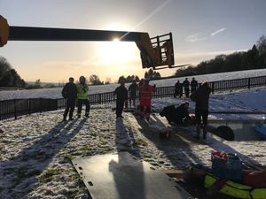A machine is brought in to help lift the horse from the pool. Picture: Steve Ball/West Midlands Fire Service