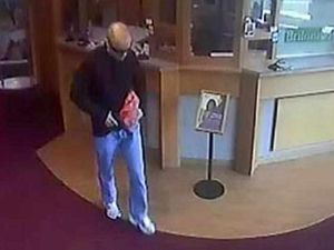 Supporting image for story: CCTV: Robber waits in line to hold up Newport bank