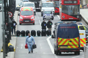 Police officers comb London Bridge for evidence after Khan's attack