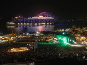 Supporting image for story: Cruise ship sends message to festival crowd as it sails past Fatboy Slim set
