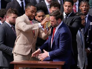 Supporting image for story: JD Vance fumbles Ohio State football championship trophy in White House visit