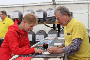 A volunteer serves a customer at the 2024 festival