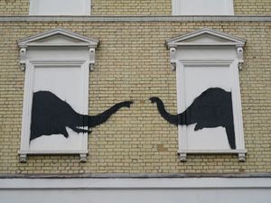 Supporting image for story: Banksy elephant artwork restored and protected after being vandalised